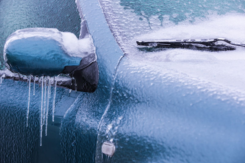 a Frozen rearview mirror of a blue car